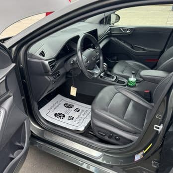 Spotless hand-detailed car interior — dash, console, and leather seats